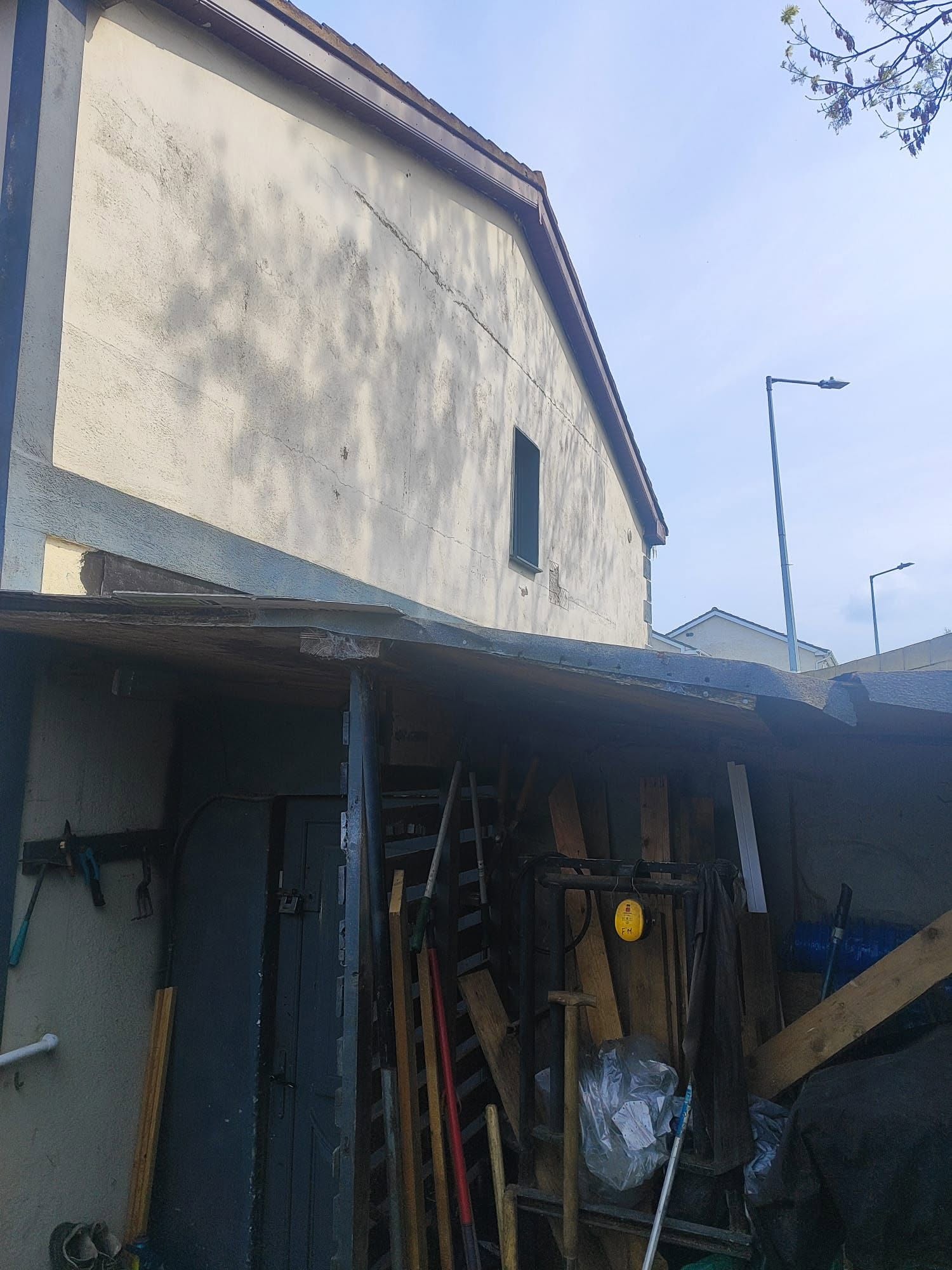 Typical weathered, cracked render before renovation
