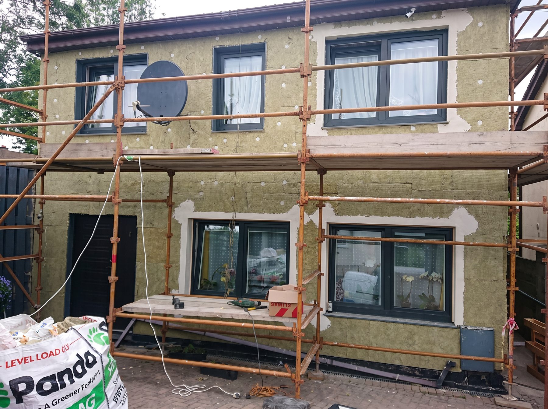 Insulation boards fixed to the external walls of a house during an EcoCore job